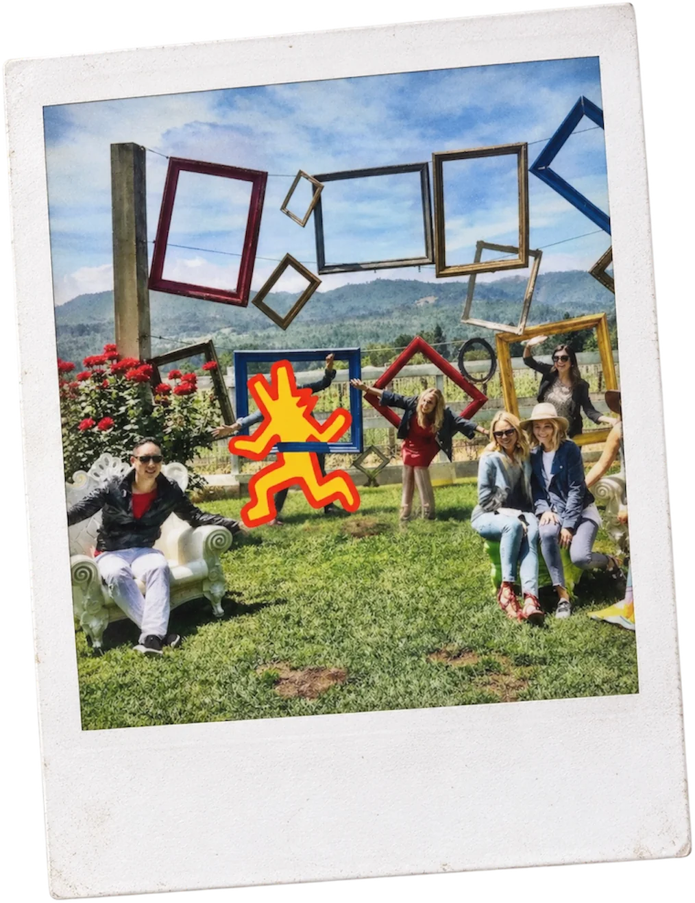 Guests posing with picture frames at a winery